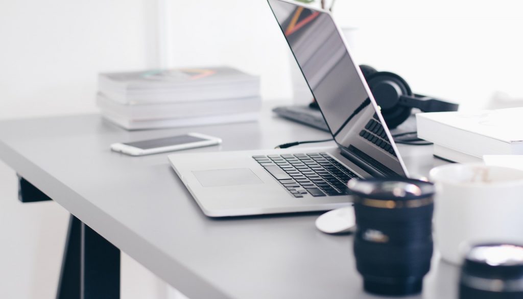 laptop and coffee on a desk